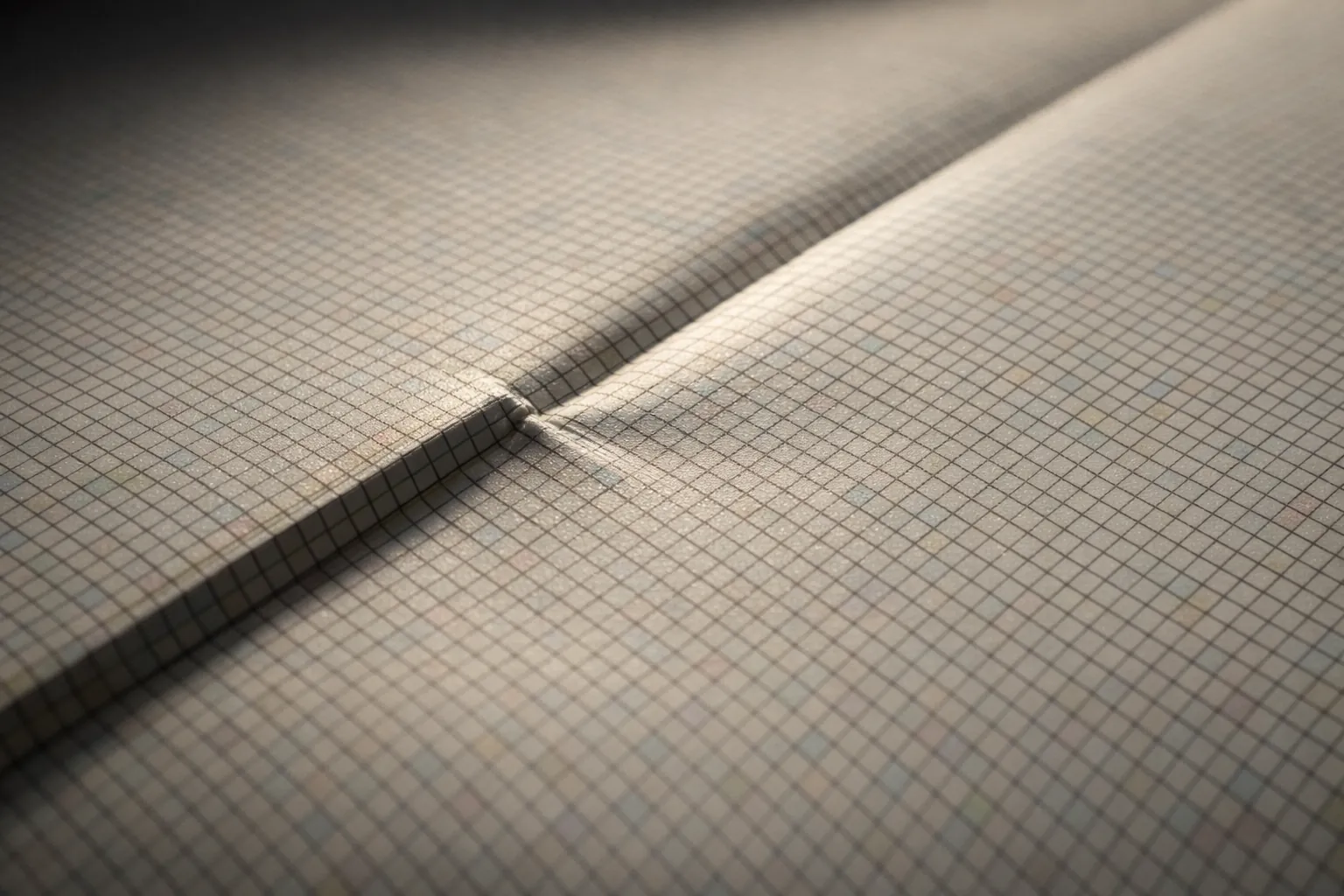 A hard fold line across a blank diamond painting canvas